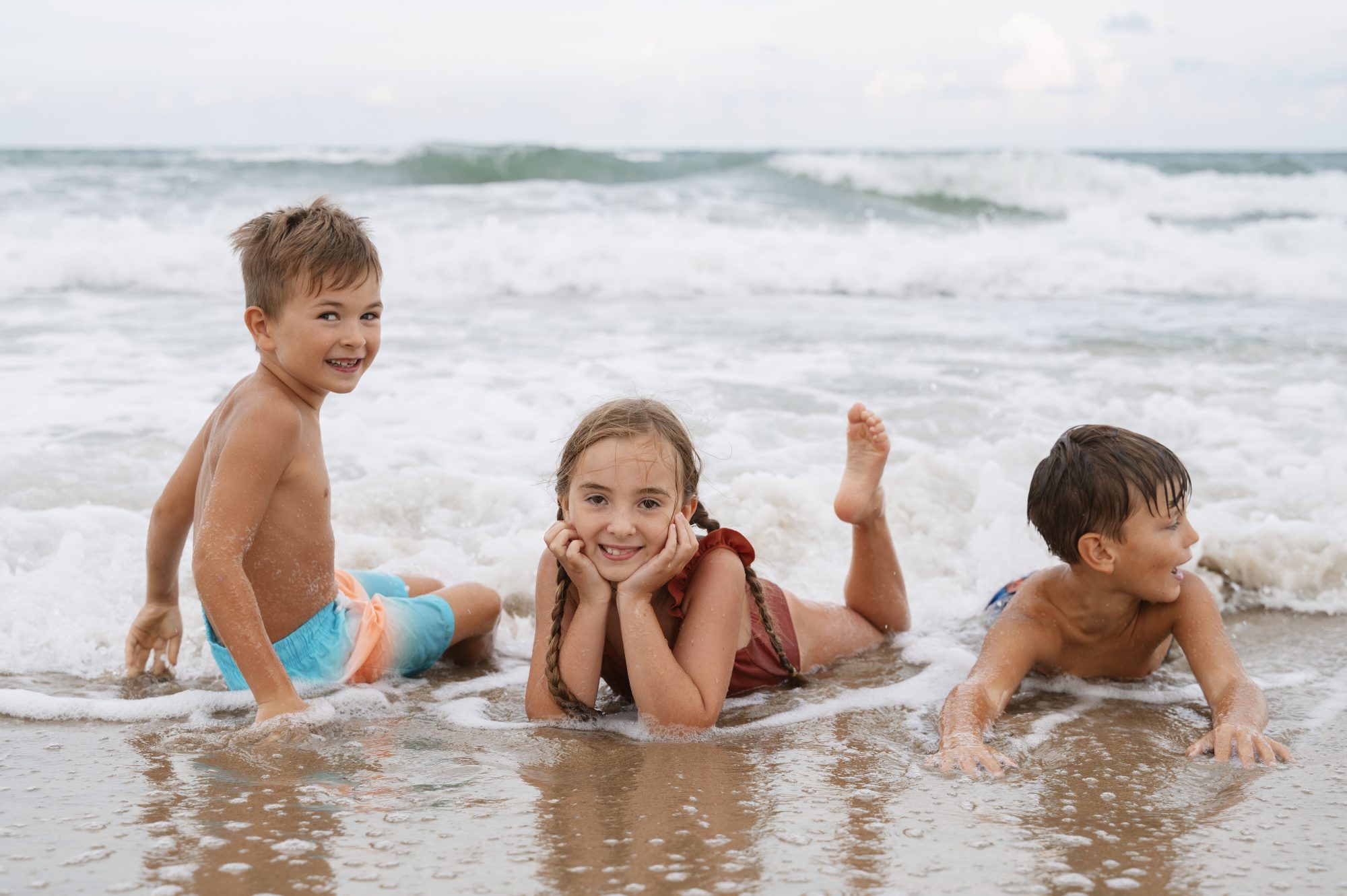 Full shot little kids having fun beach